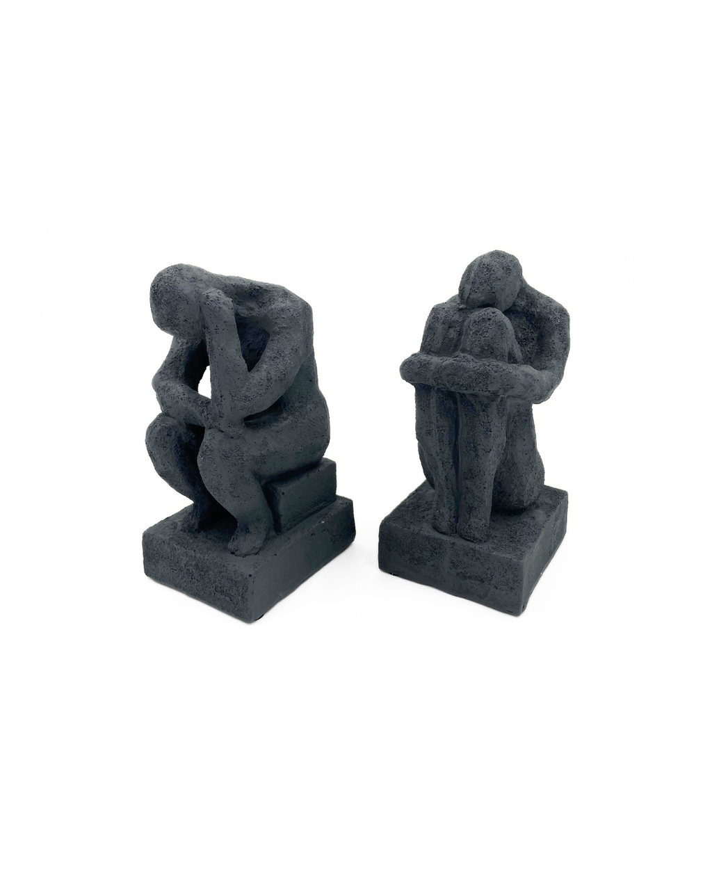 ESCULTURA PERSONAS AGACHADAS